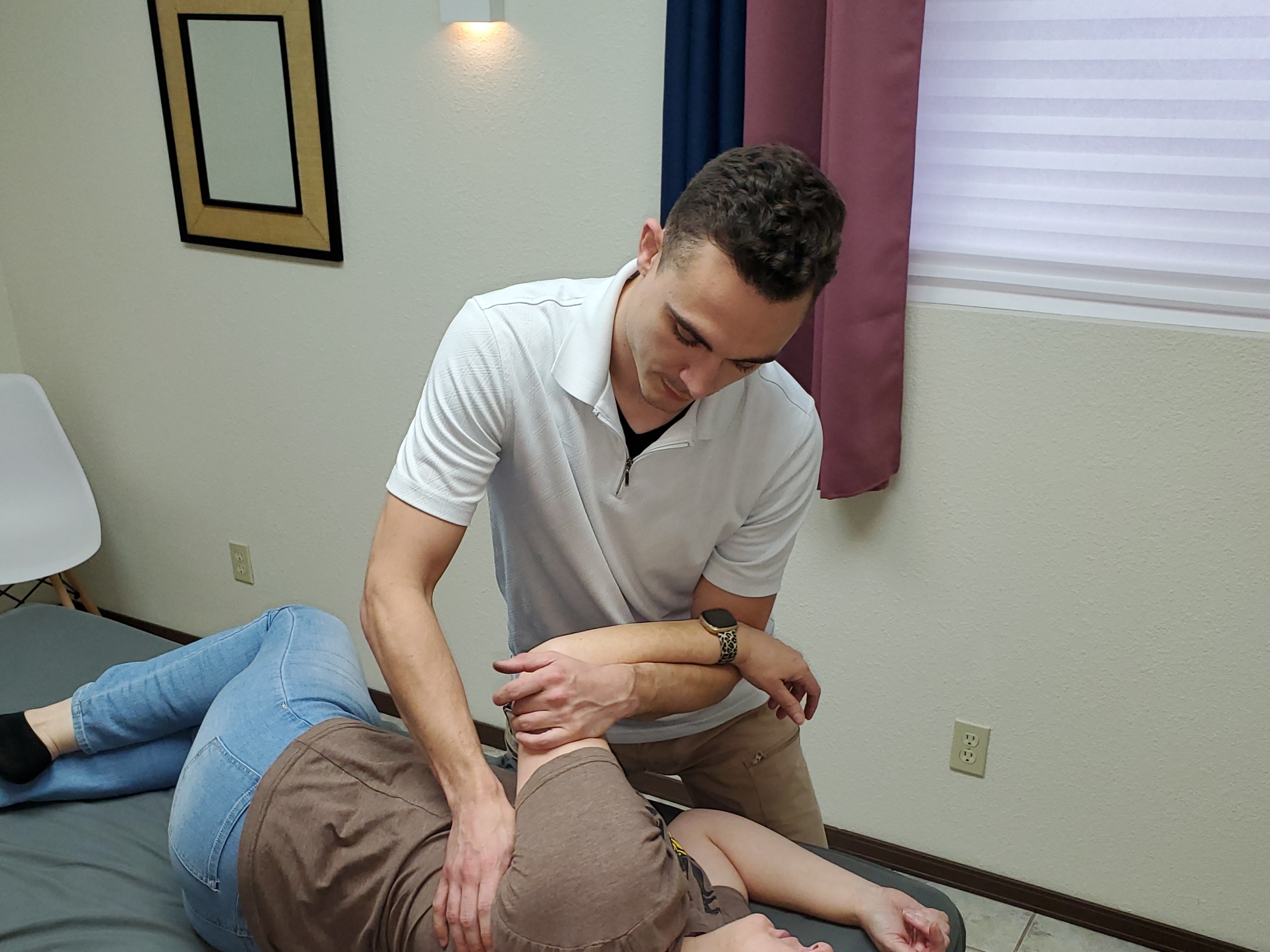 therapist demonstrates pin and stretch technique